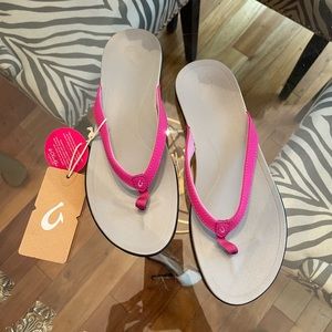 Brand new with tags! Olukai flip flops size 10. Smoke free home.
